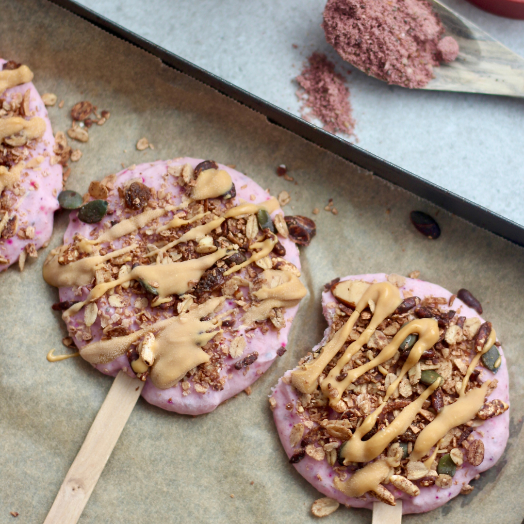 Odi Boosted Brekkie Pops - frozen yogurt breakfast pops for kids made with Greek yogurt and Smoothie Booster, topped with cereal and peanut butter drizzle