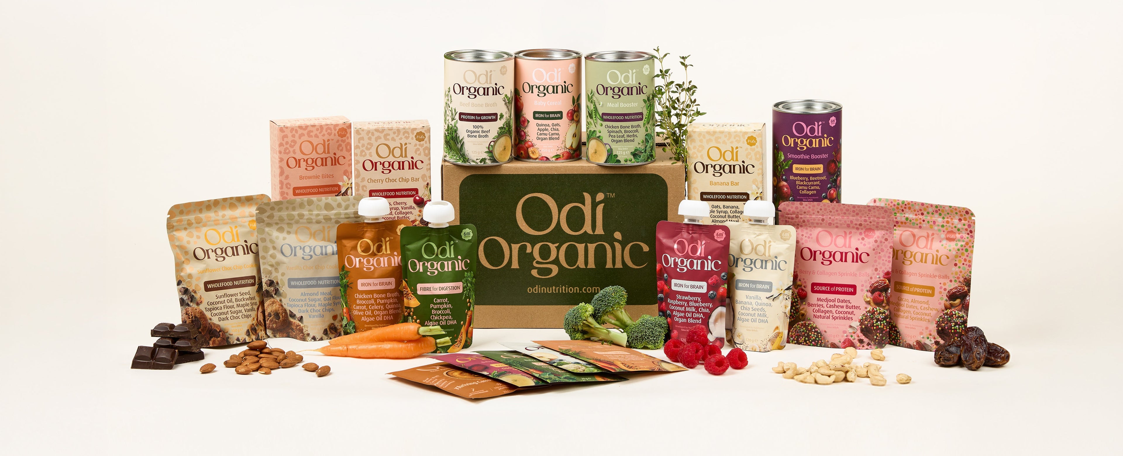 Best online baby food delivery NZ – Odi's full range of organic pouches, purees, snacks, tubs, and bundles arranged around a delivery box. Made in NZ. Delivered to your door.
